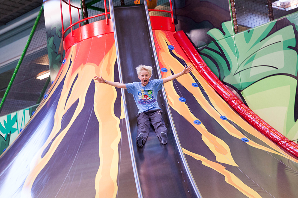 A child on the volcano slide at Dinos Ishøj